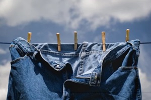 blue jeans drying on wash or clothes line